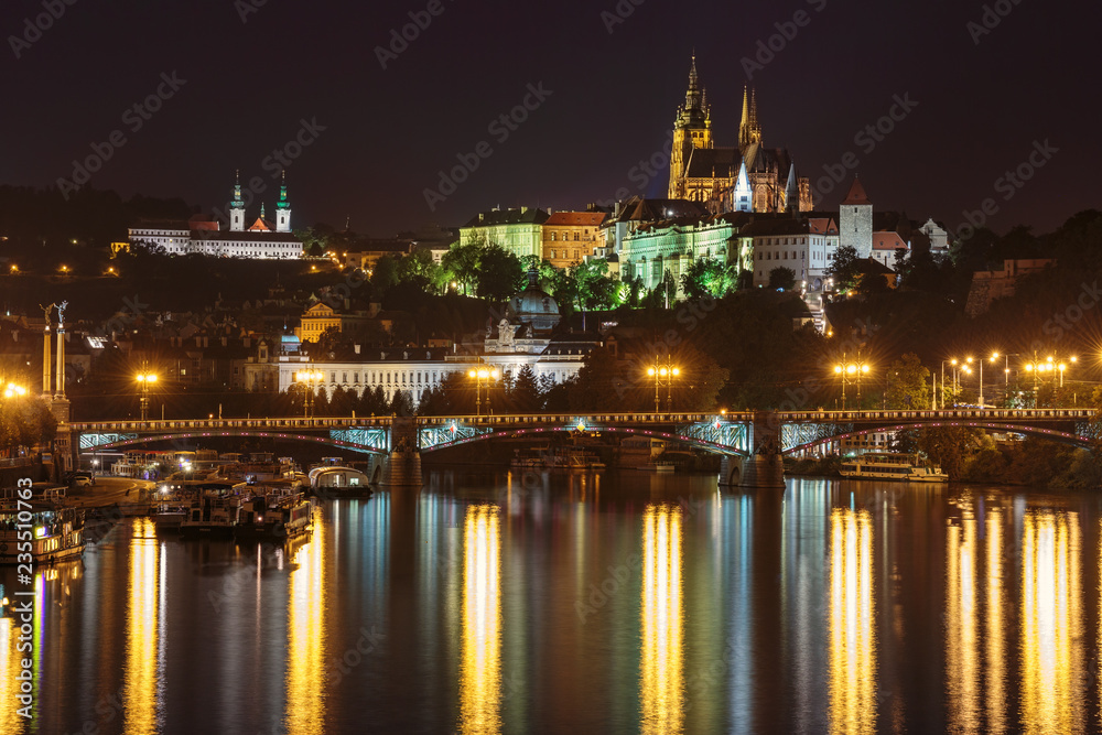 .Night panoramic view of Prague Castle and the Vltava River. Czech Republic.