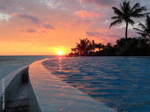 Beach on Kuredu island - infinity pool at sunset - Maldives