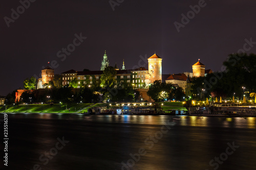 Wawel Castle in the evening in Krakow with reflection in the river, Poland. Long time exposure