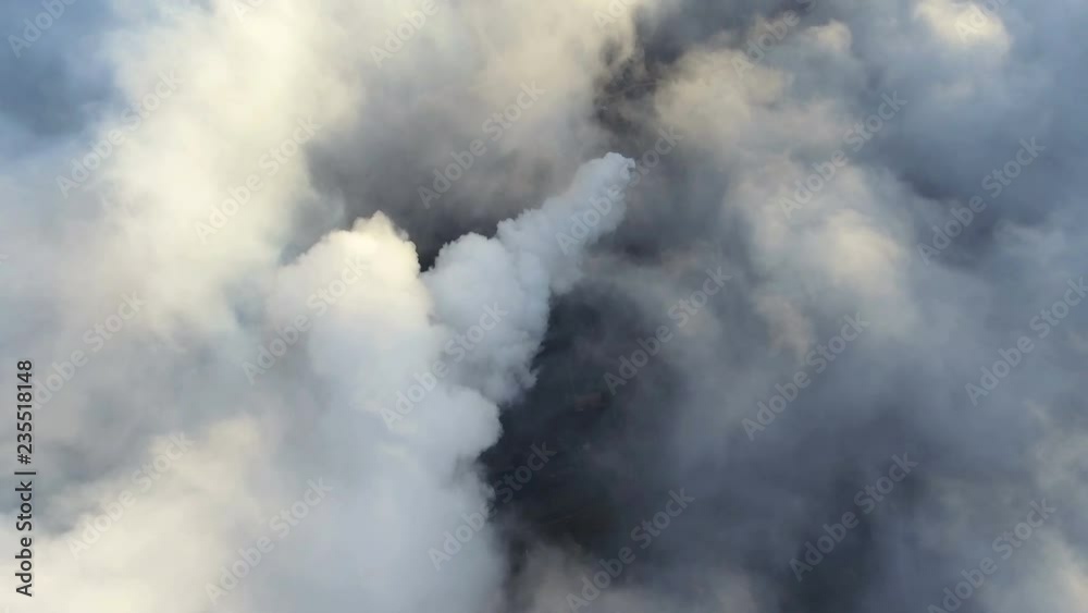 Top view of the metallurgical plant. Smoke coming out of factory pipes. Contamination of ecology in the world scale. Top view of the metallurgical plant. Smoke coming out of factory pipes. Contamination of ecology in the world scale.