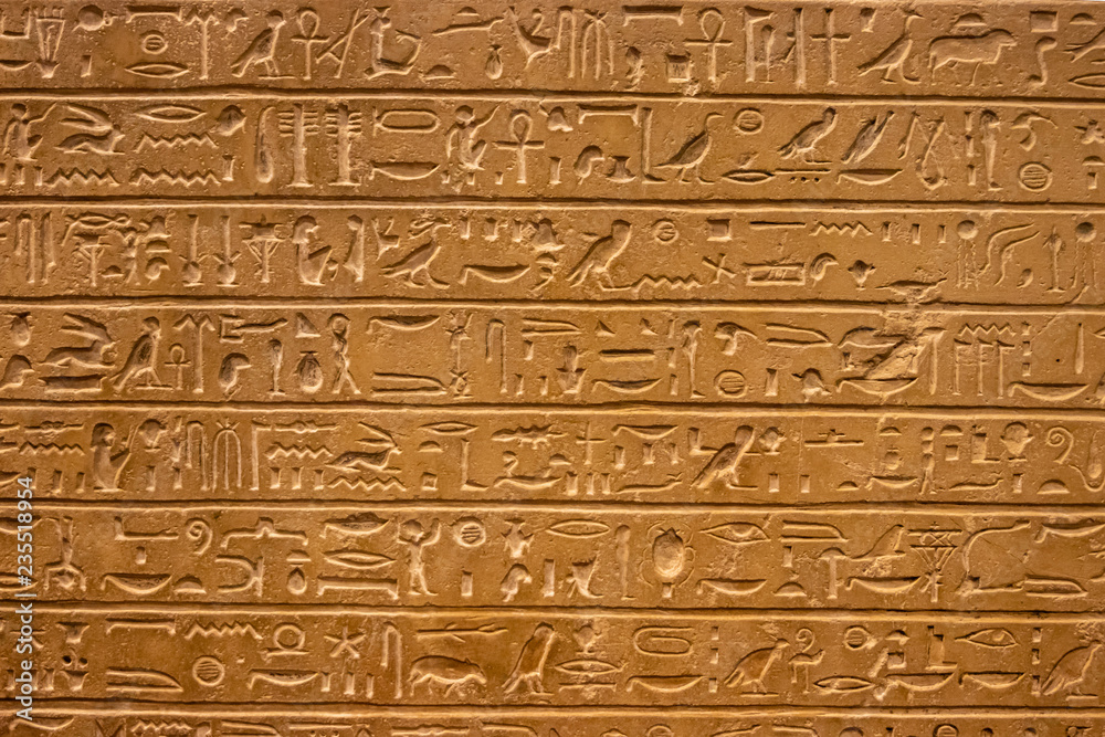 Old egypt hieroglyphs carved on the stone.