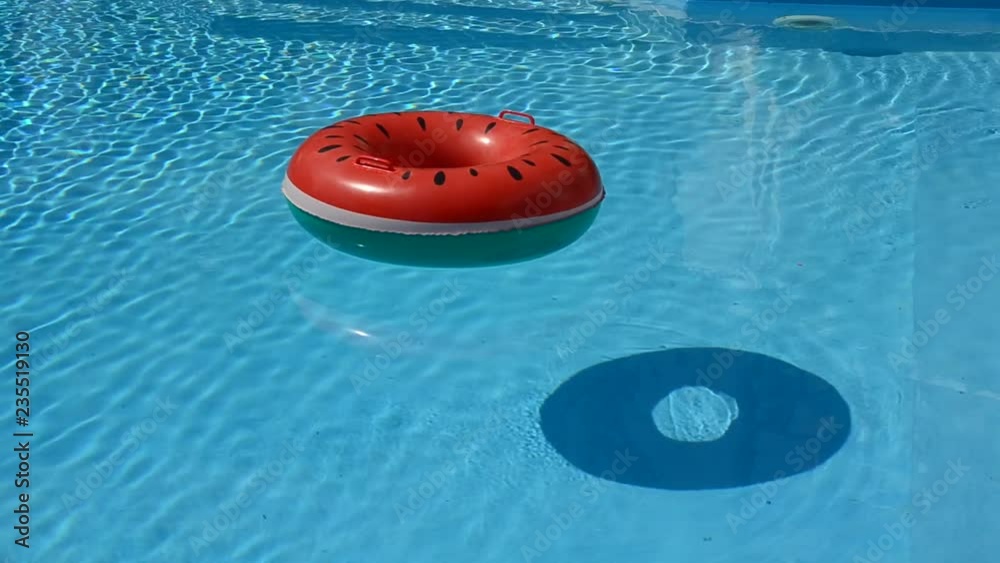 floating rubber ring, beach ball in water pool top view of crystal ...