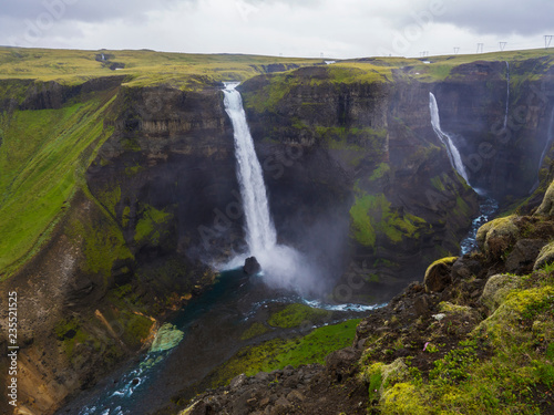Valley of river Fossa with Beautiful Haifoss waterfall in South Iceland  summer moody sky