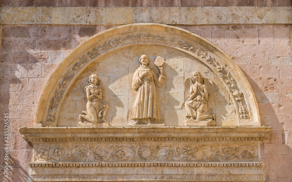 Bas relief on the Basilica of Saint Francis in Assisi, Umbria, central Italy.