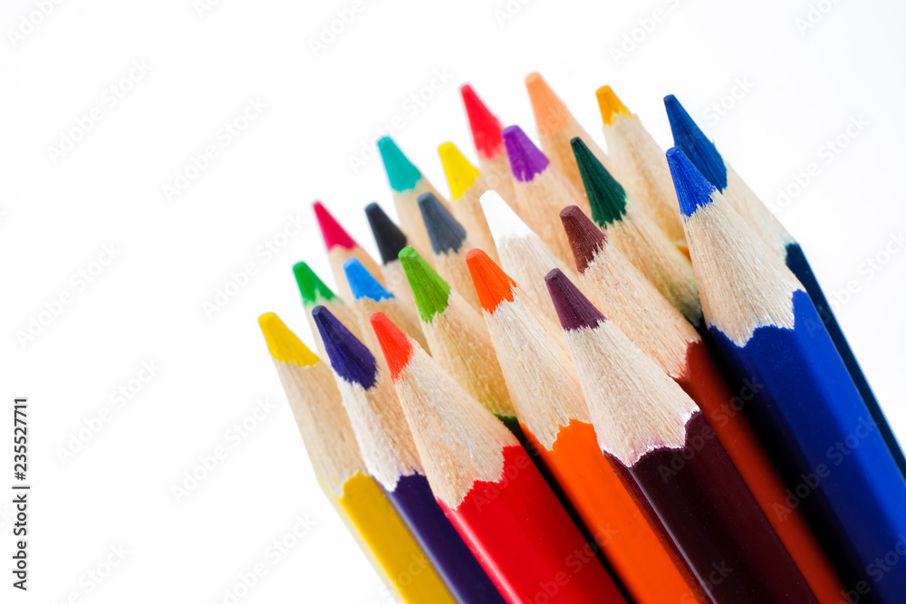 Color pencils close up on white background. The concept of drawing tools. Color pencils close up on white background. The concept of drawing tools.