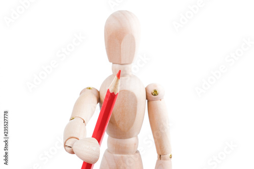 The concept of human artist. Wooden man hold red pencil on a white background.