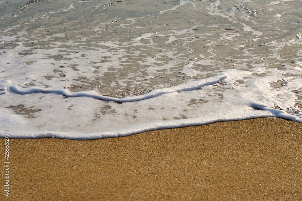 Waves with foam hitting sand on the beach texture. Waves with foam hitting sand on the beach texture.
