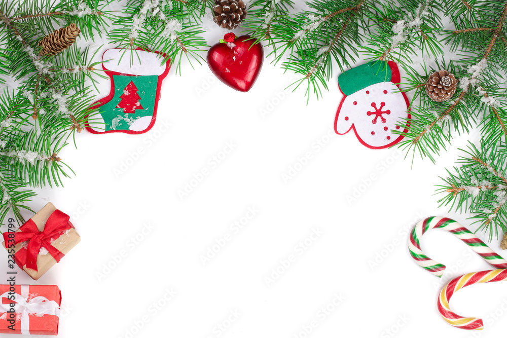 Christmas Frame of Fir tree branch with snow isolated on white background with copy space for your text. Top view Christmas Frame of Fir tree branch with snow isolated on white background with copy space for your text. Top view