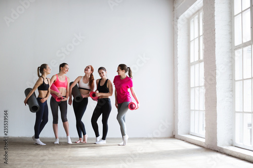 Happy group of fit women at the gym.