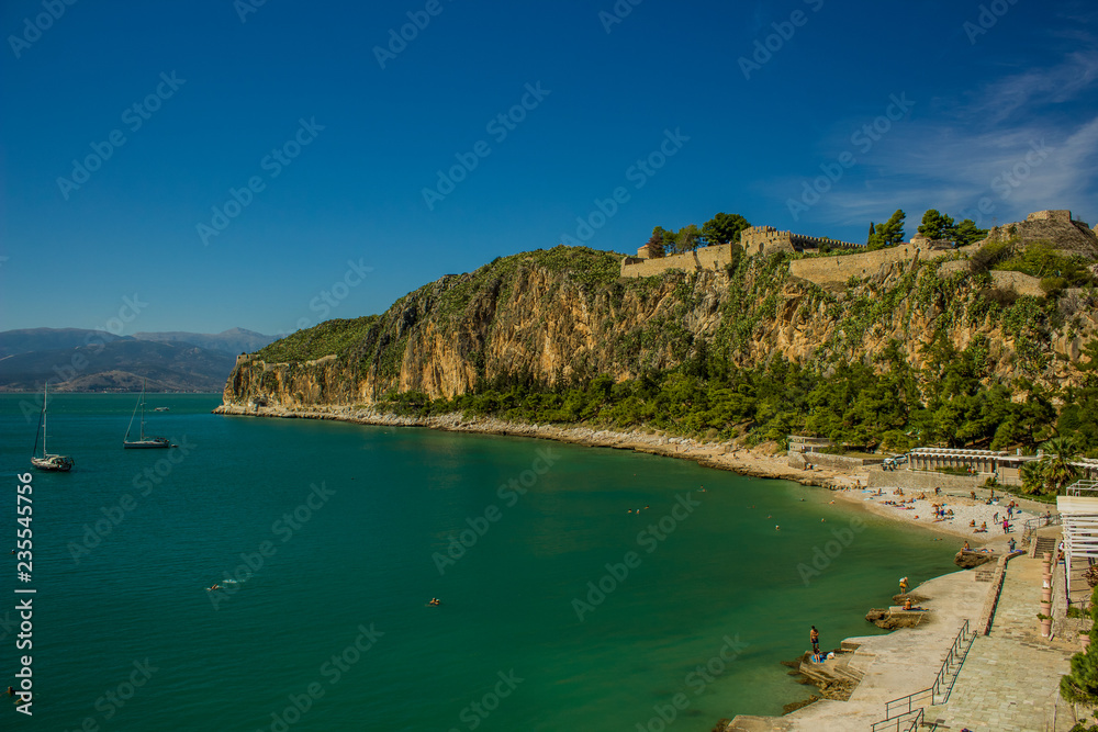 Old medieval castle on top of rock beautiful nature scenery landscape with sea bay shore line place in Mediterranean tropic district 