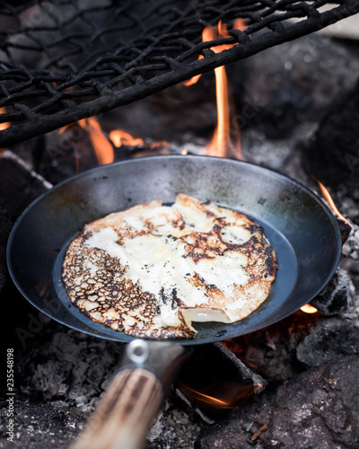 Wallpaper Mural Cooking delicious crepes on campfire. Torontodigital.ca