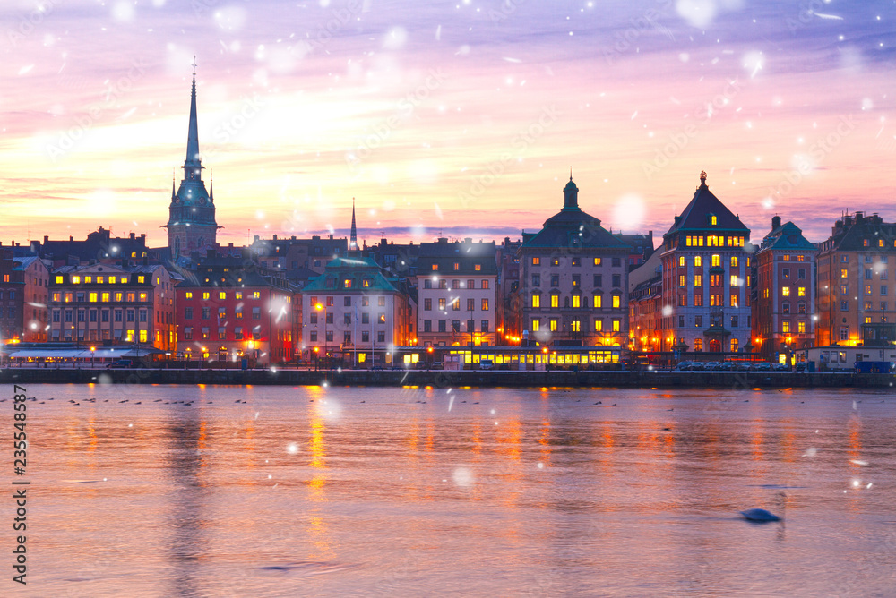 Fototapeta premium sunset scenery of the Old Town in Stockholm with snow, Sweden