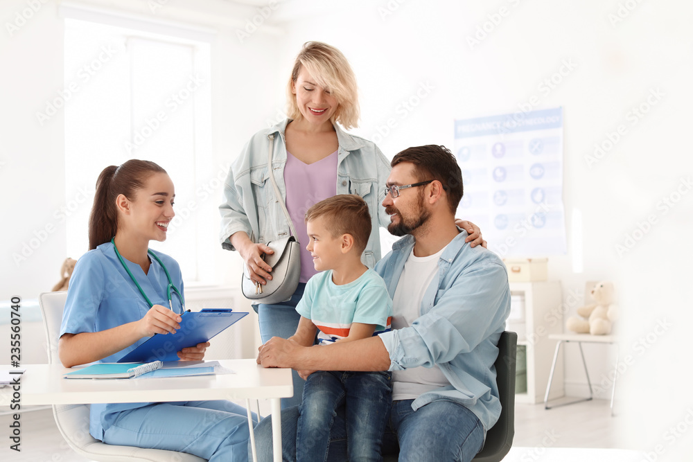 Little boy with parents visiting children's doctor in hospital Little boy with parents visiting children's doctor in hospital