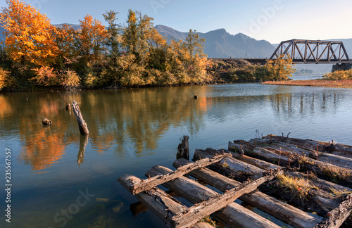 Fotografie Wooden frame of the old pier in the fall in the bay of the Columbia River