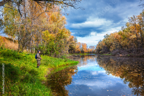 Autumn landscape with a fisherman. Suzun, Novosibirsk region, Western Siberia photo