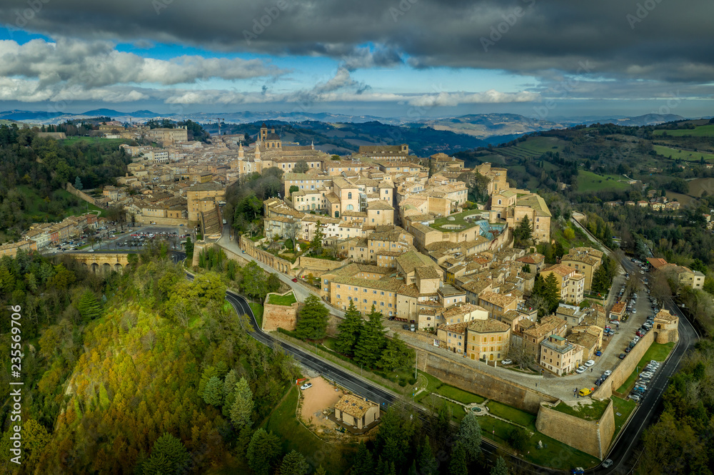 Aerial view of Urbino medieval town with university, church, walls and ducal palace in the Marche region Italy