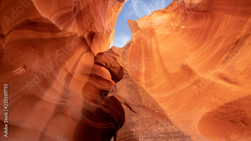 Blue sky with white cloud above orange yellow color sandstone cliff of Upper antelope