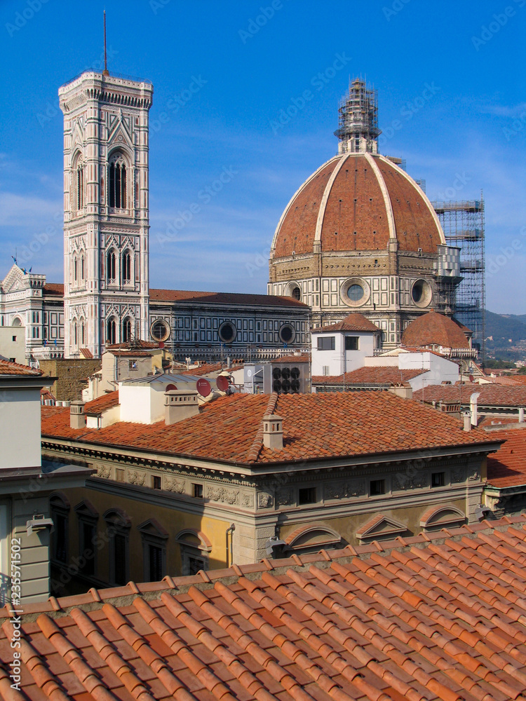 The Duomo on the skyline and red rooftops of the city of Florence, Italy