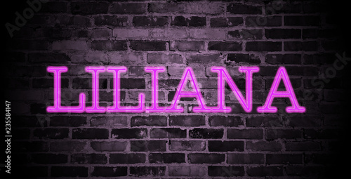 first name Liliana in pink neon on brick wall