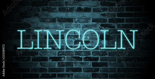 first name Lincoln in blue neon on brick wall © christopher-oliver