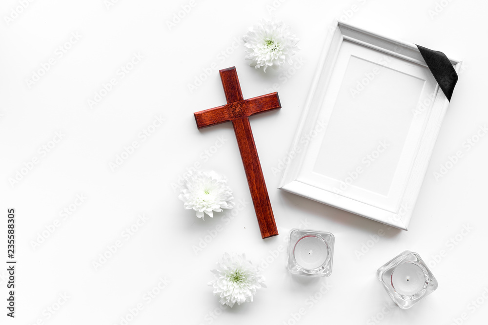 Funeral. Mockup of portrait of the deceased, of dead person. Frame with  black ribbon near flowers, candles and cross on white background top view  copy space Stock Photo | Adobe Stock