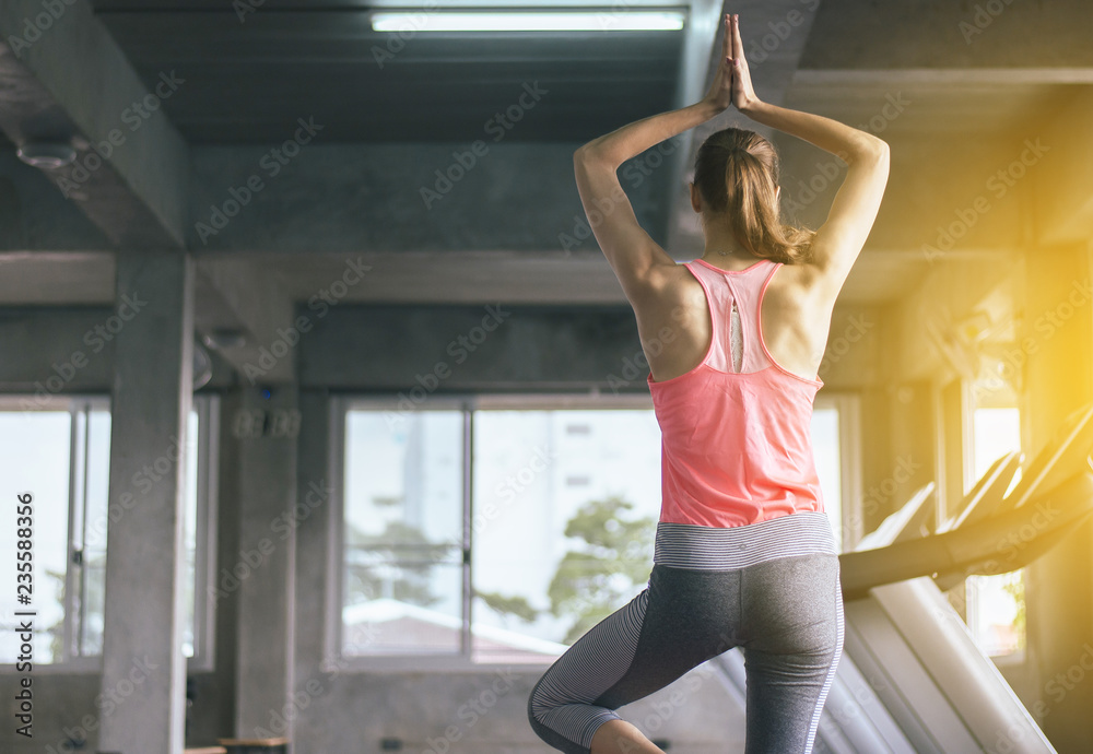 Woman practicing doing yoga exercise and workout in gym,Healthy and lifestyle concept Woman practicing doing yoga exercise and workout in gym,Healthy and lifestyle concept