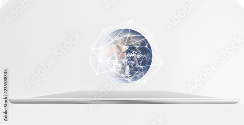Fototapeta Naklejka Na Ścianę i Meble -  Digital tablet with global network hologram. Networking technology and smart technology. Element of this image are furnished by NASA