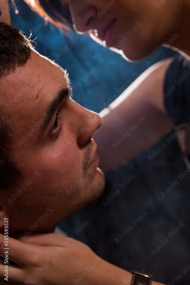 Fototapeta premium Young punk girl cuts her boyfriend