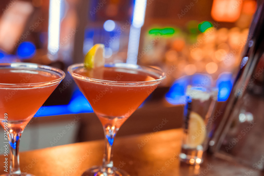 Ice cocktail cosmopolitan. Drinks on the background of the bar. Place to write a recipe Ice cocktail cosmopolitan. Drinks on the background of the bar. Place to write a recipe