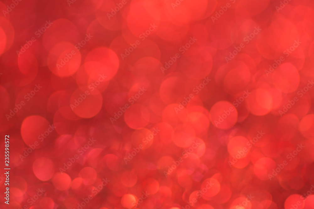 Red bokeh background defocused lights texture.
