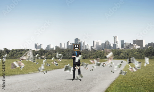 Businessman with old TV instead of head.