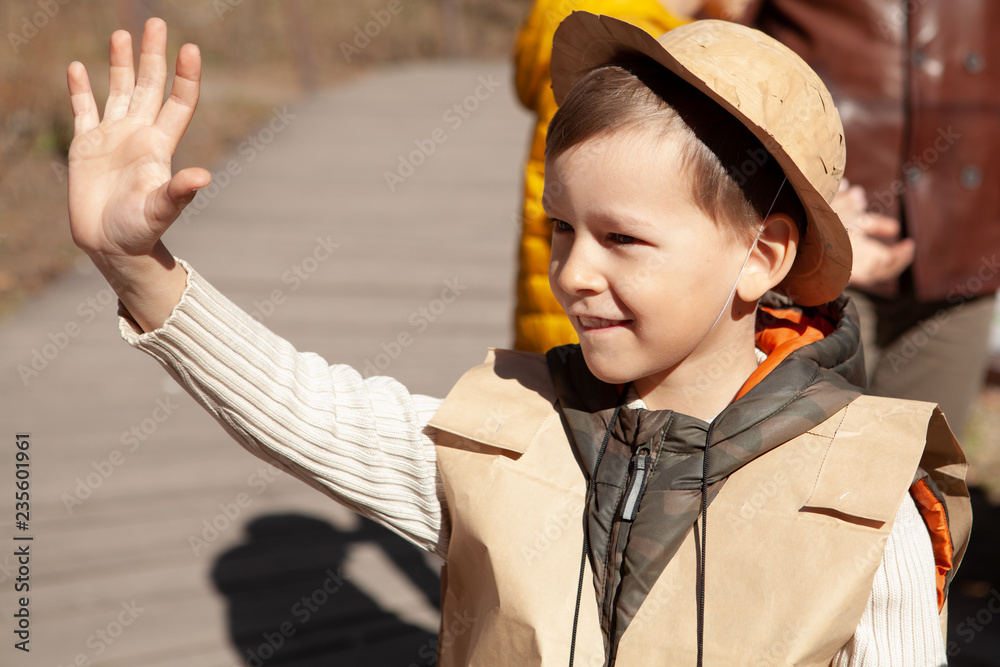 fun birthday with boy in paleontologist costume. Stock Photo Adobe Stock