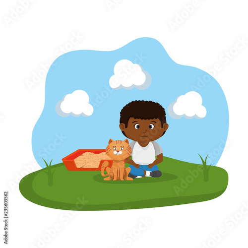 cute cat and boy with sandbox