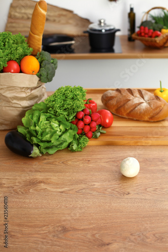 Fototapeta Naklejka Na Ścianę i Meble -  Desk  with many fresh vegetables and fruits in the kitchen. Cooking, vegetarian and shopping concept