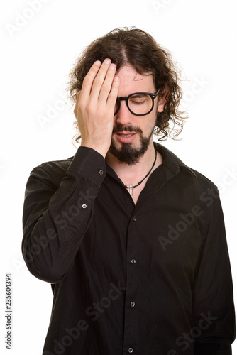 Handsome Caucasian man looking tired and stressed with failure