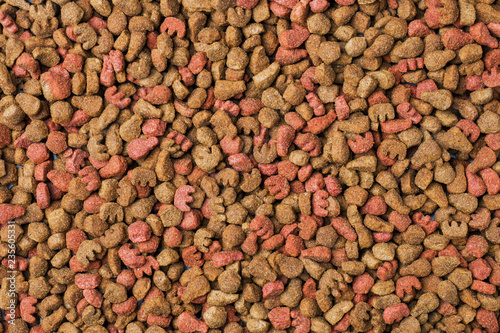 Dry cat food. Full population. Background of the granules.