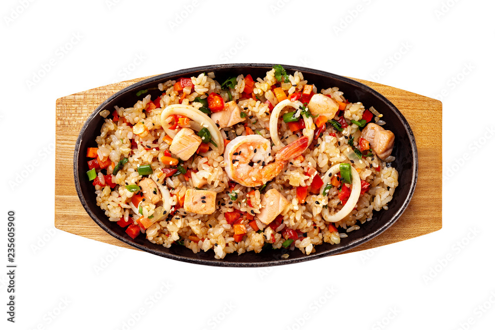 Top view pan of traditional Japanese rice with vegetables and seafood at wooden board isolated at white background. Top view pan of traditional Japanese rice with vegetables and seafood at wooden board isolated at white background.