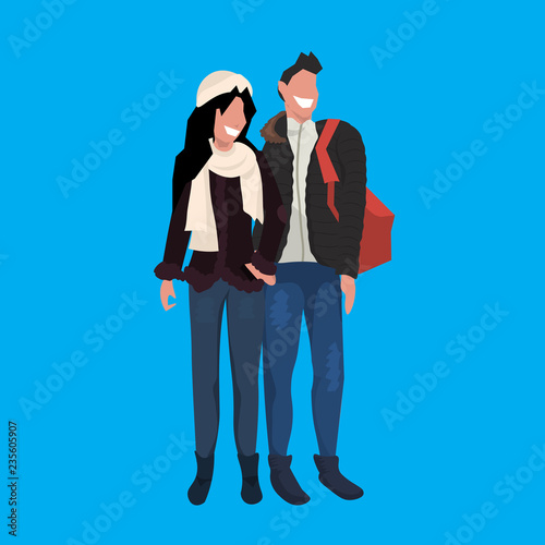 man woman couple wearing winter clothes standing together male female cartoon character full length blue background flat vector illustration