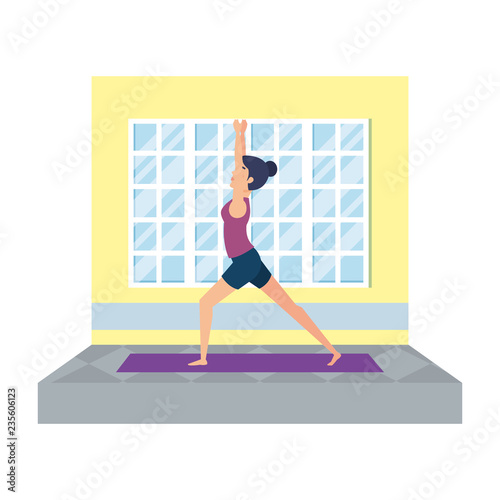 woman practicing yoga in the gym