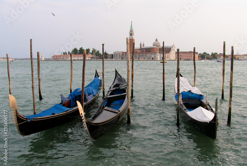 Colorful gondolas in Venice, Italy frame the island of San Giorgio Maggiore © Steve Azer