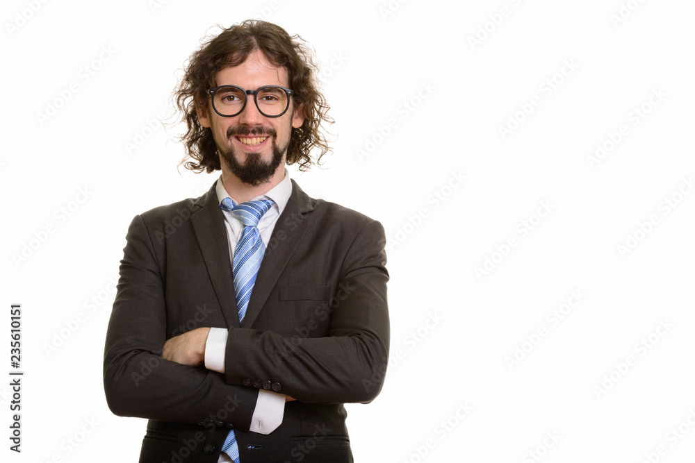 Happy handsome Caucasian businessman with arms crossed Happy handsome Caucasian businessman with arms crossed