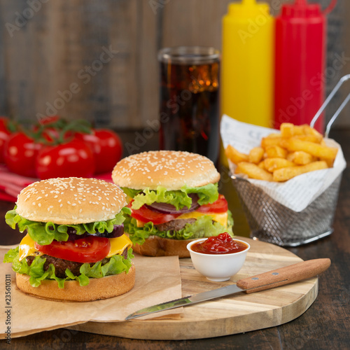 Burger with French fries cutlet with cheese and tomato