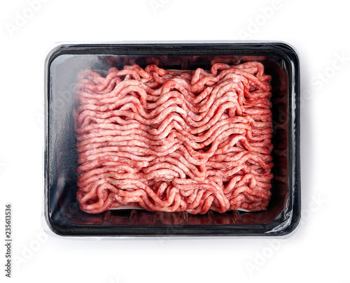 Plastic tray with raw fresh pork minced meat on white background. Packaging design for mock up.