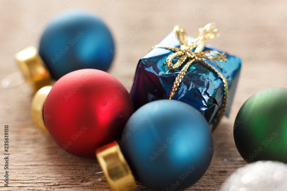 Christmas decoration. New year gifts and christmas tree balls on wooden background Christmas decoration. New year gifts and christmas tree balls on wooden background