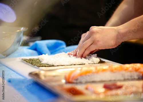 chef hands preparing japanese food, chef making sushi, Preparing Sushi roll