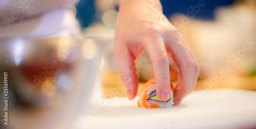 chef hands preparing japanese food  chef making sushi  Preparing Sushi roll