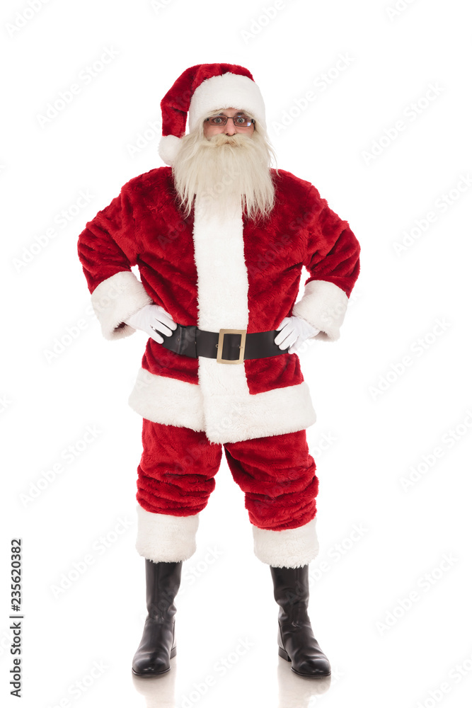 merry santa claus stands while holding his hips merry santa claus stands while holding his hips