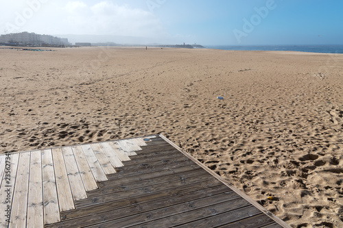 Wooden path by the ocean in Nazare  Portugal.