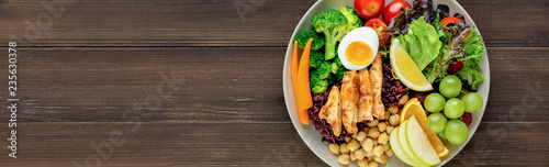 Fényképezés Clean food with mixed vegetable and fruit salad on wood banner background