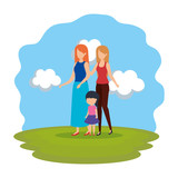 lesbian couple with daughter in the park